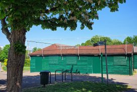 The old wooden building in The Grove used as a Cricket Pavilion, Park Cafe, Bowling Club, and possibly Stables